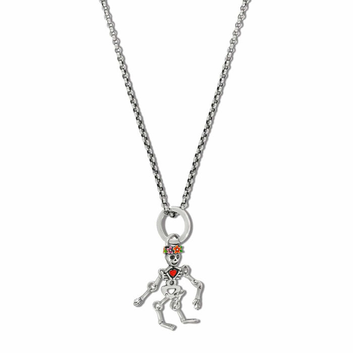 Brighton pendant necklace with silver-plated skeleton charm, enamel floral crown, and red heart accent on a white background