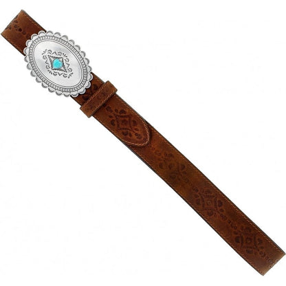 Brighton tooled brown leather belt with oval silver-tone concho buckle and turquoise stone accent on a white background