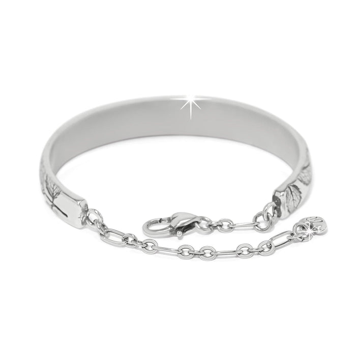 Brighton bangle bracelet with silver-plated finish, engraved leaf detailing, lobster clasp, and chain accent on a white background