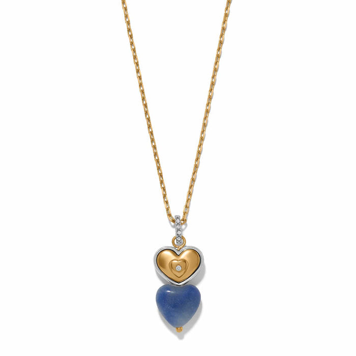 Brighton pendant necklace with two-tone heart charm, blue stone heart drop, and crystal accents on a white background