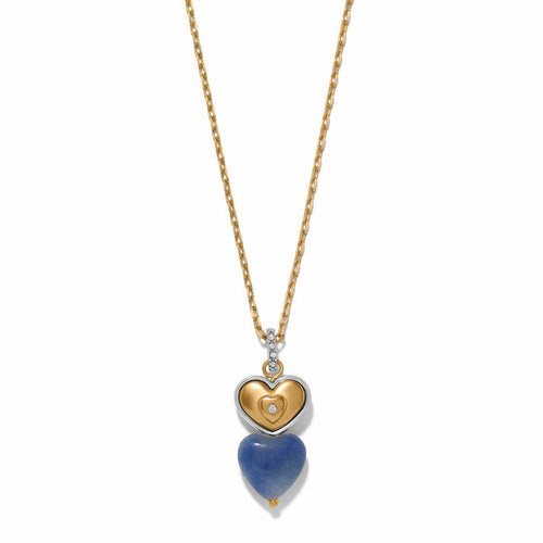 Brighton pendant necklace with two-tone heart charm, blue stone heart drop, and crystal accents on a white background