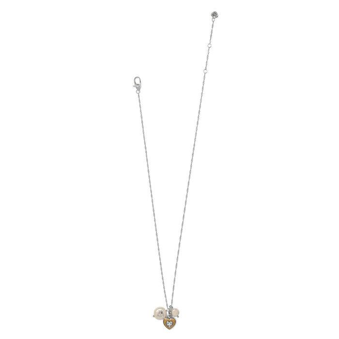 Brighton necklace with two-tone heart pendant, crystal accents, and coin glass pearl charms on a white background