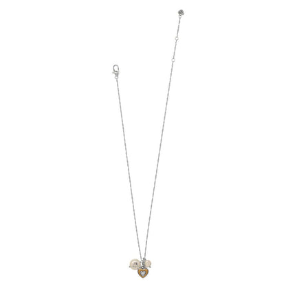 Brighton necklace with two-tone heart pendant, crystal accents, and coin glass pearl charms on a white background