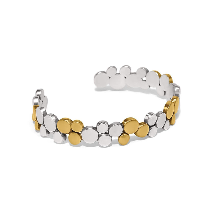Brighton cuff bracelet with clustered silver-tone and gold-tone two-tone disc design on a white background