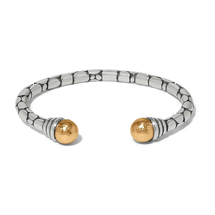 Brighton cuff bracelet in two-tone finish with silver pebbled band and hammered gold ball ends on a white background