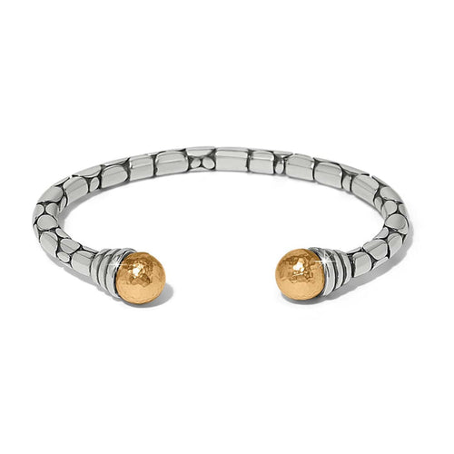 Brighton cuff bracelet in two-tone finish with silver pebbled band and hammered gold ball ends on a white background