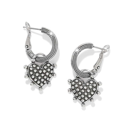 Brighton hoop earrings with silver-plated ribbed hoops and dotted heart charms with beaded edges on a white background