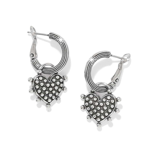 Brighton hoop earrings with silver-plated ribbed hoops and dotted heart charms with beaded edges on a white background
