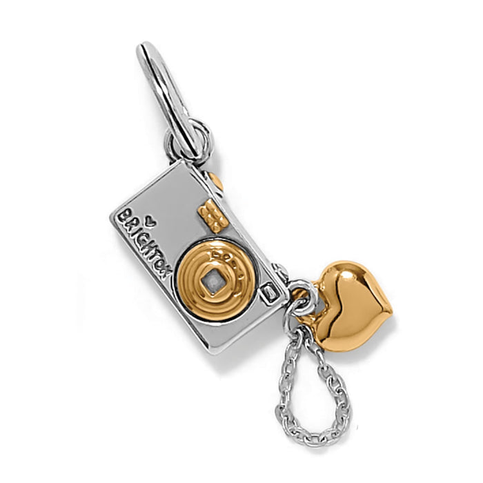 Brighton camera charm with silver-tone body, gold-tone lens and heart accent, and hanging chain strap on a white background