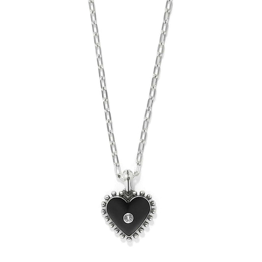 Brighton heart pendant necklace with black enamel, silver-plated beaded edge, and crystal center on a white background