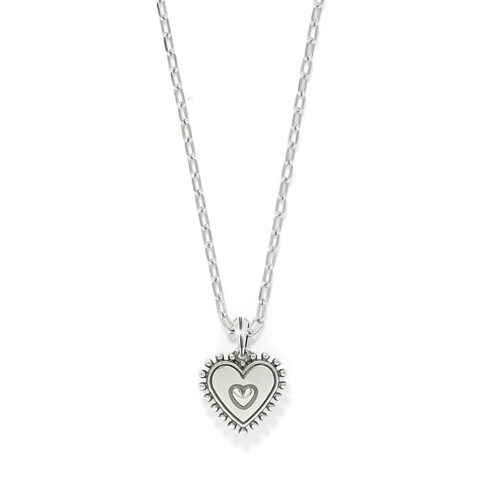 Brighton pendant necklace with silver-plated heart charm and beaded border on delicate chain on a white background