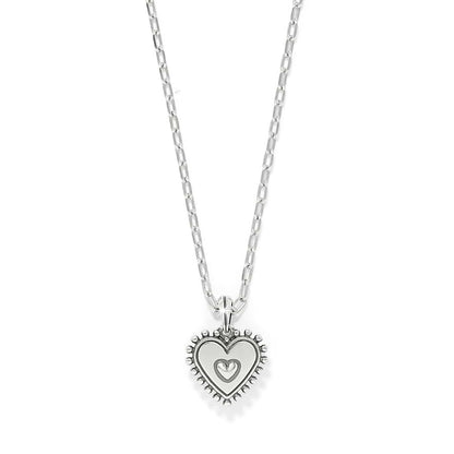 Brighton pendant necklace with silver-plated heart charm and beaded border on delicate chain on a white background