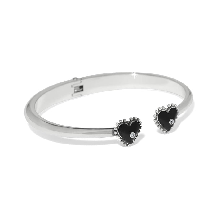 Brighton hinged cuff bracelet with silver-plated finish and black heart end caps with crystal accents on a white background