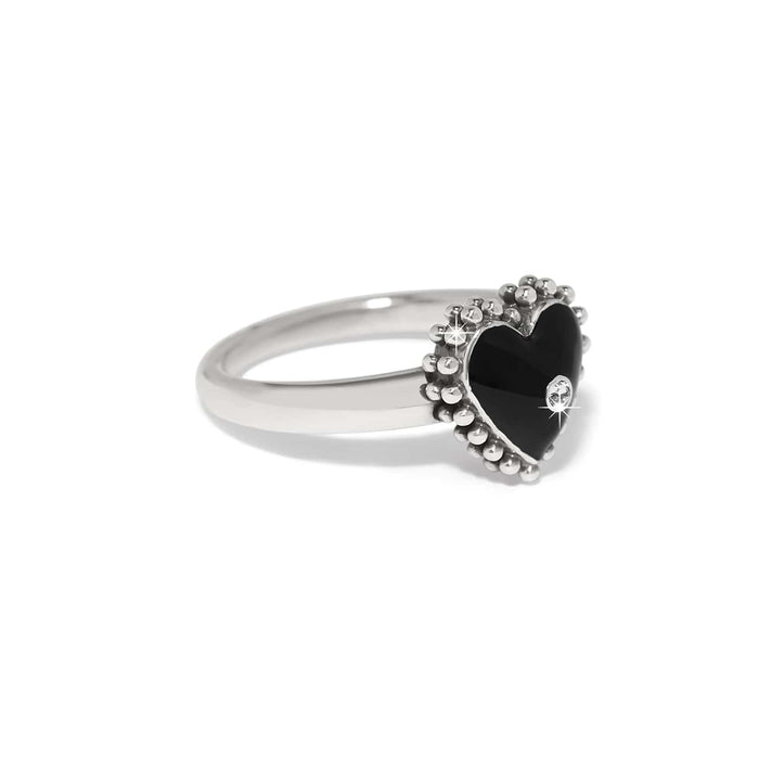 Brighton silver-plated ring with black enamel heart, crystal accent, and beaded border on a white background