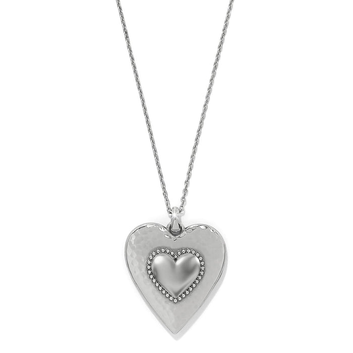 Brighton pendant necklace with silver-plated hammered heart and beaded smaller heart accent on a white background