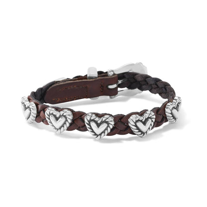 Brighton braided brown leather bracelet with silver-plated heart stations and buckle closure on a white background