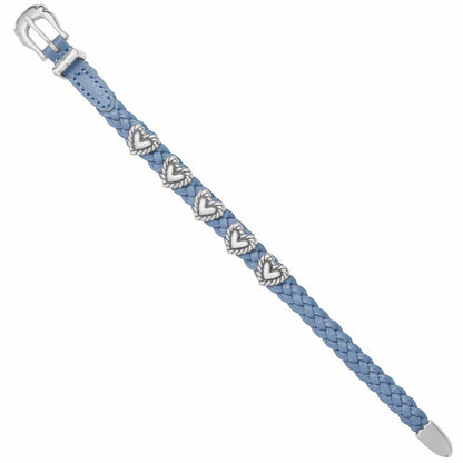 Brighton braided blue leather bracelet with silver-plated heart accents and buckle closure on a white background