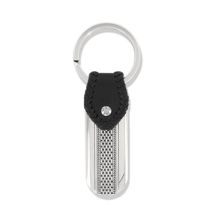 Brighton key fob with black braided leather accent, silver-tone tag, woven texture detail, and split ring on a white background