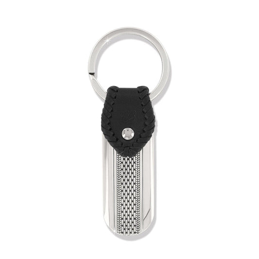 Brighton key fob with black braided leather accent, silver-tone tag, woven texture detail, and split ring on a white background