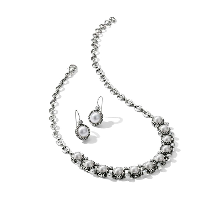 Brighton silver-plated necklace and drop earrings set with glass pearls and crystal accents on a white background