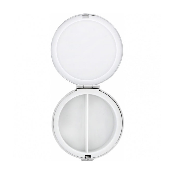 Brighton round pill case shown open with mirrored lid and two-compartment white interior on a white background