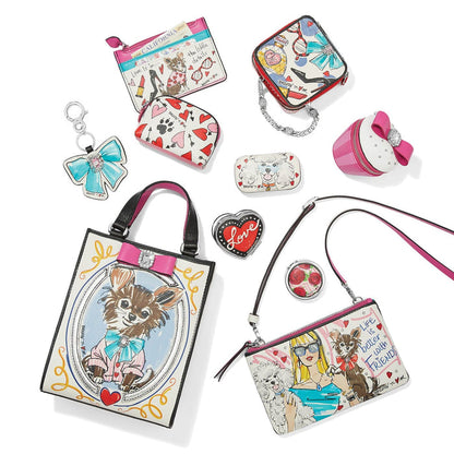 Brighton handbag collection styled with illustrated dog prints, coordinating pouches and other accessories on a white background