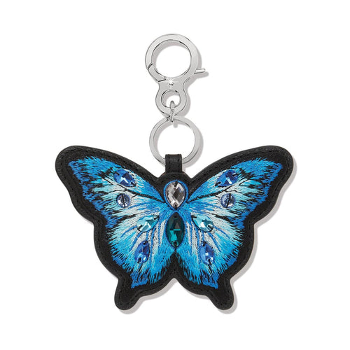 Brighton butterfly bag charm with blue embroidered leather wings, crystal accents, and silver-tone clasp on a white background