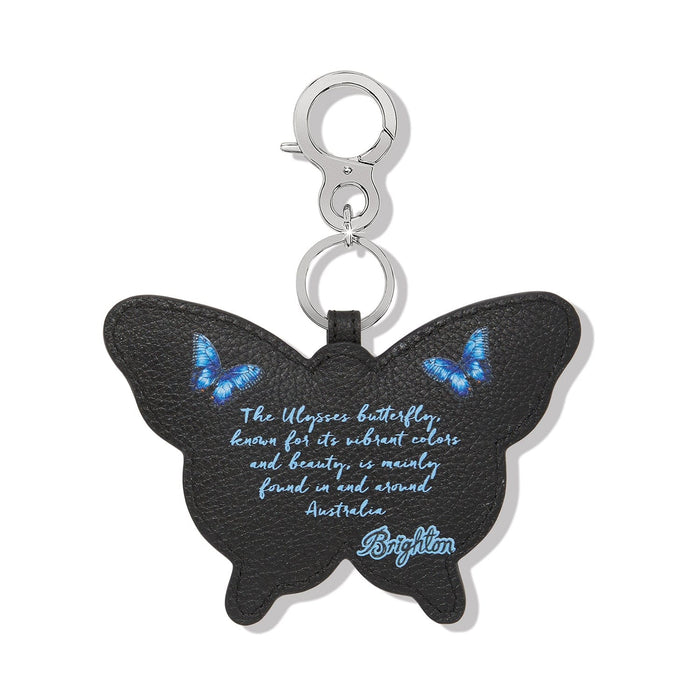 Brighton butterfly bag charm in black leather with blue butterfly print and silver-tone clasp on a white background