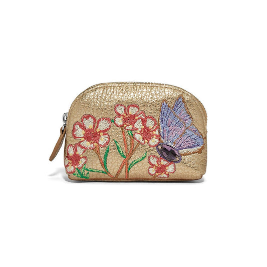 Brighton gold metallic pouch with embroidered floral design and purple butterfly featuring crystal accent on a white background