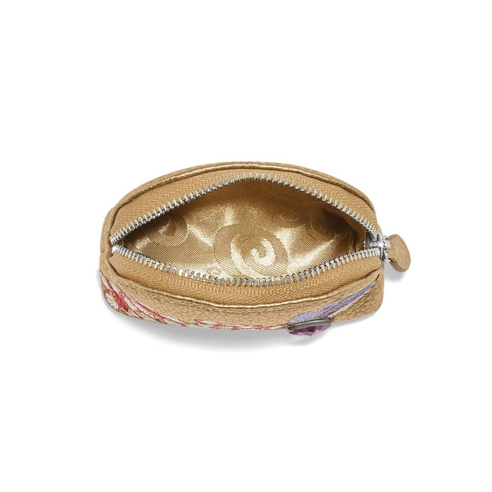 Brighton coin pouch shown open with gold metallic interior, floral print exterior, and silver-tone zipper on a white background
