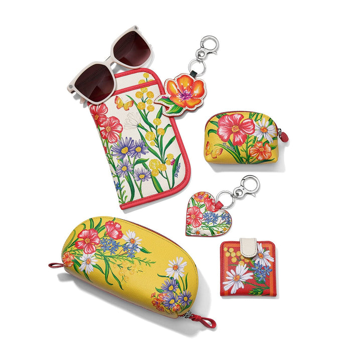 Brighton sunglasses pouch with floral print, styled with coordinating glasses case and other accessories on a white background