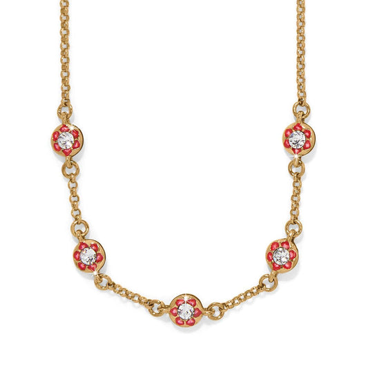 Brighton gold-plated necklace with red enamel flower stations and crystal centers on a white background