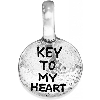 Brighton round charm with silver-plated finish and engraved Key To My Heart text on a white background