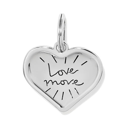 Brighton heart charm in silver-tone finish engraved with Love More script and radiating lines on a white background