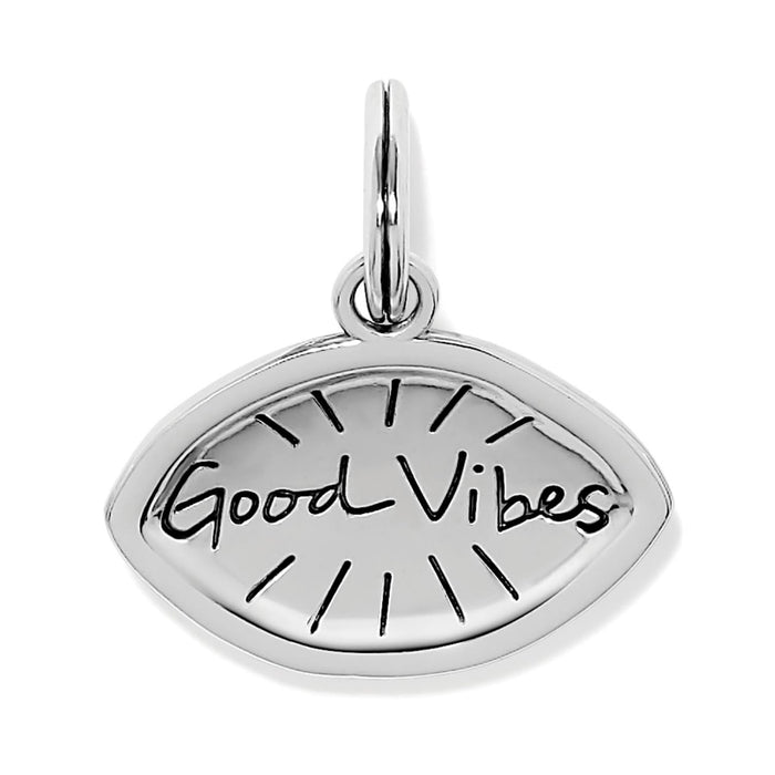 Brighton silver-plated charm with eye shape and engraved Good Vibes script and sun rays on a white background