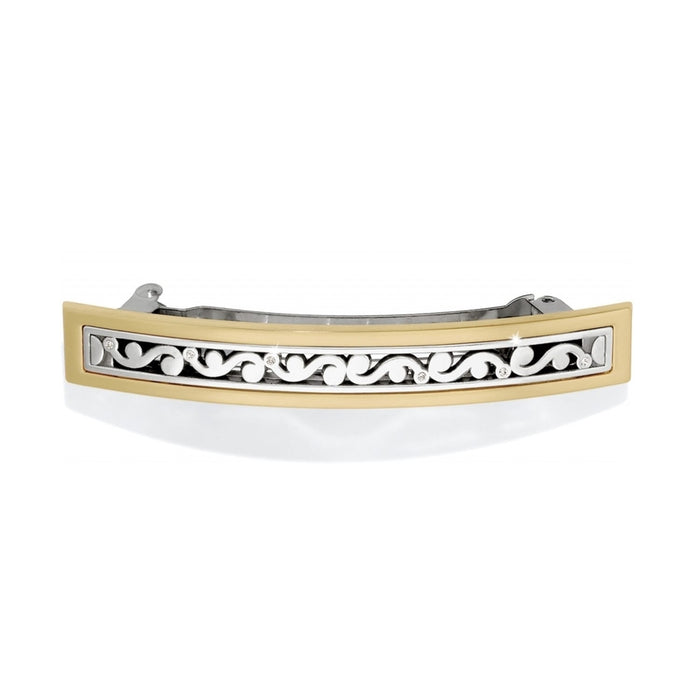 Brighton hair barrette with gold-tone frame and silver-tone scroll design accented with crystals on a white background