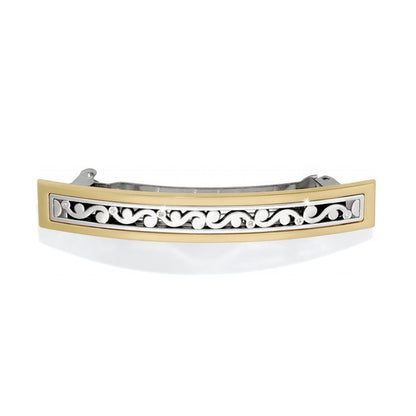 Brighton hair barrette with gold-tone frame and silver-tone scroll design accented with crystals on a white background