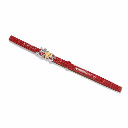 Brighton red croc-embossed leather belt with silver-tone scroll buckle and gold-tone heart accent on a white background