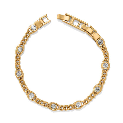 Brighton bracelet with gold-plated curb chain links and round crystal stations on a white background