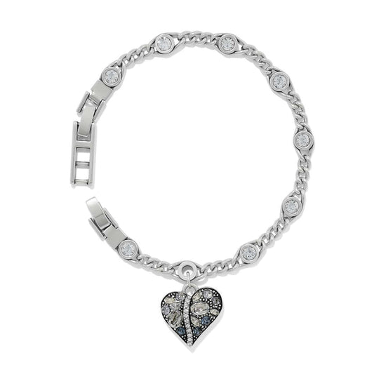 Brighton silver-plated chain bracelet with crystal stations and dangling crystal-encrusted heart charm on a white background