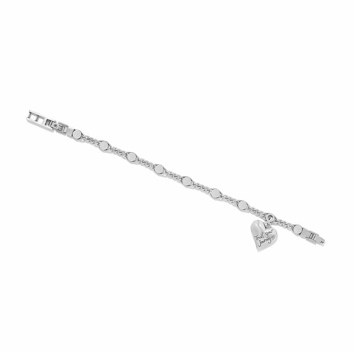 Brighton charm bracelet with silver-plated curb chain, round links, and engraved heart charm on a white background