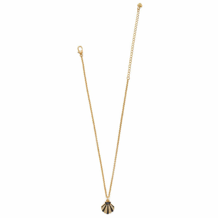 Brighton pendant necklace with gold-tone chain and black enamel shell charm with crystal accents on a white background