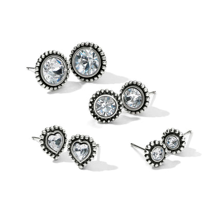 Brighton stud earrings set with silver-plated beaded borders and round and heart-shaped crystals on a white background