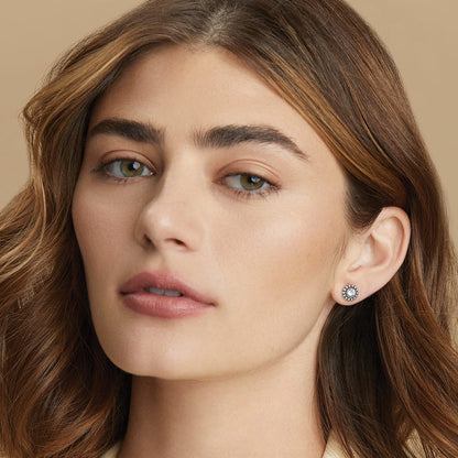 Model wearing a Brighton silver-plated stud earring with a central crystal surrounded by beaded silver-plated border