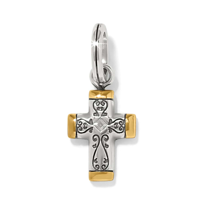 Brighton cross charm with silver-tone scrollwork, gold-tone tipped ends, and center crystal accent on a white background