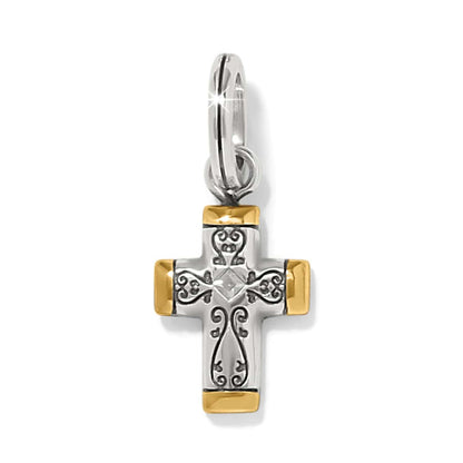 Brighton cross charm with silver-tone scrollwork, gold-tone tipped ends, and center crystal accent on a white background