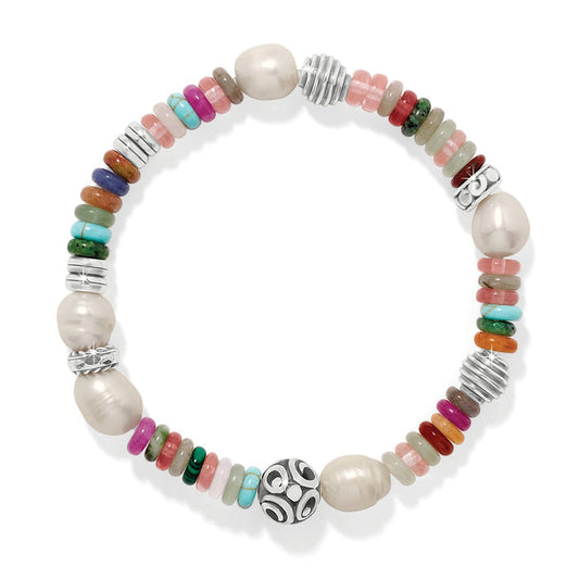 Brighton beaded bracelet with glass pearls, mixed gemstones, fuchsia dyed jade, and silver-plated accents on a white background