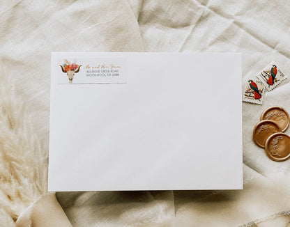 White envelope with address label on a textured beige surface